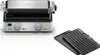 A product shot of a grill and grill plates on a white background. Podgląd zdjęcia produktu