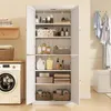 A white storage cabinet filled with various bathroom or laundry items, placed next to a washing machine. Voir les images du produit