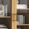 A close-up view of a wooden cabinet with glass doors, showing books on shelves and metal handles. Podgląd zdjęcia produktu