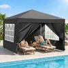 A couple relaxing under a black pop-up canopy next to a swimming pool. Anteprima dell’immagine prodotto