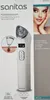 The image shows the packaging of a Sanitas pore cleaner, with a product shot and a lifestyle image of a woman. Produktbild-Vorschau
