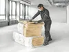 A construction worker wearing protective gear is handling insulation materials in a building under construction. Anteprima dell’immagine prodotto
