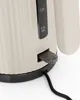 Close-up of a modern electric kettle base, showing a water level indicator and the power switch. Náhľad obrázku produktu
