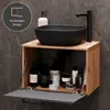 A bathroom vanity with a black sink and faucet, and storage below. Produktbild-Vorschau