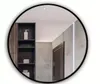 A round mirror with a black frame reflecting a bathroom or hallway interior. Anteprima dell’immagine prodotto