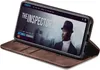 A smartphone in a brown flip case is displayed, showing a movie streaming interface on its screen. Produktbild-Vorschau