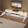 A modern living room with a TV stand and a large TV mounted on the wall. Podgląd zdjęcia produktu