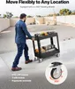 A man is pushing a black utility cart loaded with tools outdoors. Anteprima dell’immagine prodotto