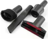 A set of four black vacuum cleaner attachments are arranged on a white background. The attachments include a brush head, a crevice tool, a universal nozzle with red inserts, and an adapter piece. Produktbild-Vorschau