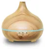 A wooden-patterned aroma diffuser with blue LED lighting and control buttons. Podgląd zdjęcia produktu