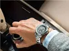 A man's hand wearing a Maserati watch is shown operating a car's gear shift. Anteprima dell’immagine prodotto