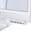 A close-up shot of a Satechi USB-C hub attached to the side of a white iMac computer. Produktbild-Vorschau