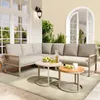 A sectional outdoor sofa set with two coffee tables on a patio. Produktbild-Vorschau