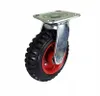 A single caster wheel with a black pneumatic tire and a red rim, mounted on a silver metal bracket. Podgląd zdjęcia produktu