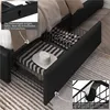 Close-up view of the storage drawers under a bed, showing a hat and blankets inside. Produktbild-Vorschau