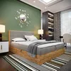 A bedroom scene featuring a boxspring bed, nightstands, a mirror, and a bookshelf. Voir les images du produit