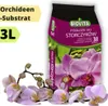 A bag of orchid substrate with orchids in the foreground. Produktbild-Vorschau