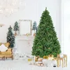 A decorated Christmas tree stands in a room with a fireplace and furniture. Produktbild-Vorschau
