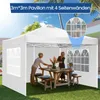 People enjoying a meal under a white pop-up gazebo in a backyard. Voir les images du produit