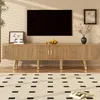 A living room scene featuring a TV stand with a television above it, and a rug in the foreground. Produktbild-Vorschau
