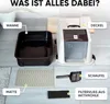 A disassembled cat litter box with its components laid out on a floor, with labels pointing to each part. Produktbild-Vorschau