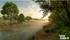 A serene river landscape at sunrise with fog. Produktbild-Vorschau