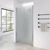 A modern bathroom with a frosted glass shower enclosure and a towel rack. Náhled obrázku produktu