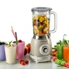 A vintage-style blender filled with fruit, surrounded by colorful smoothies and fresh produce. Produktbild-Vorschau