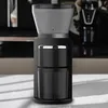 A black electric coffee grinder is shown on a white surface with a blurred background. Produktbild-Vorschau
