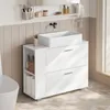 A modern white bathroom vanity with a vessel sink, next to a toilet. Náhled obrázku produktu