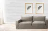 A living room scene with a sofa and wall art, showcasing the decorative wall panels. Produktbild-Vorschau