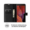 A black wallet case for a smartphone, open to reveal card slots and a phone screen with a colorful abstract wallpaper. Produktbild-Vorschau
