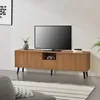 A TV stand with a television on top, in a living room setting. Produktbild-Vorschau