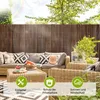 An outdoor patio scene with a wicker sofa and coffee table, featuring a bamboo privacy screen in the background. Produktbild-Vorschau