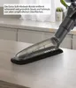 A close-up of a vacuum cleaner attachment with a brush head on a countertop. Produktbild-Vorschau