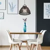 A dining table with chairs and a pendant light in a room. Produktbild-Vorschau