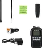 A collection of items for a walkie-talkie, including the device itself, accessories, and batteries. Voir les images du produit