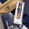 A Cuisinart electric wine opener is presented in its packaging, alongside a box and scissors, on a patterned background. Podgląd zdjęcia produktu
