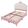 A pink bed frame with a crown-shaped headboard is shown against a white background. Podgląd zdjęcia produktu