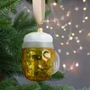 A glass beer mug ornament hangs on a Christmas tree with blurred lights in the background. Produktbild-Vorschau