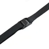 A close-up view of a black strap with a black buckle, likely part of a roof box lift system. Voir les images du produit