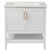 A white bathroom vanity with a ceramic sink and two cabinet doors with gold handles, set against a white background. Náhľad obrázku produktu