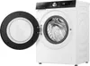 A white Hisense washing machine with its door open, showing the drum inside. The control panel is visible at the top. Produktbild-Vorschau