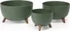 Three green planters of varying sizes, each supported by three wooden legs, are displayed against a white background. Produktbild-Vorschau