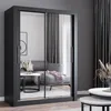 A modern bedroom or living room setting with a large sliding door wardrobe with mirrored doors. Produktbild-Vorschau