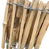 A close-up view of a wooden fence made of vertical wooden stakes bound together with wire. Produktbild-Vorschau