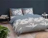 A bedroom scene with a bed dressed in floral bedding. Produktbild-Vorschau