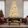 A living room decorated for Christmas with a wall-mounted wooden Christmas tree and a traditional Christmas tree. Anteprima dell’immagine prodotto