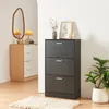 A shoe cabinet with three flip drawers is shown in a room setting. Produktbild-Vorschau
