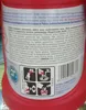 A close-up of a red bottle with a label showing safety instructions and symbols. Náhled obrázku produktu
